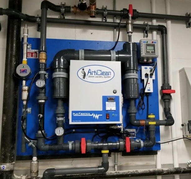 ArtiClean ozone laundry system with pipes, gauges, valves, and control panel